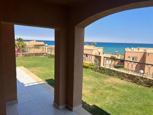 a view of the ocean from a house balcony at Private Villa Sea View 5BR in Ain Sokhna