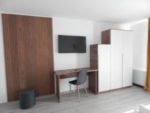 Et tv og/eller underholdning på Pensiunea Ramedal