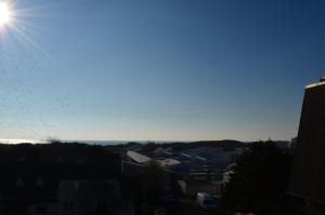 a view of the sun setting over a city at Studio "L'authentique" vue sur la Baie d'Authie in Berck-sur-Mer