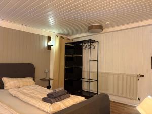a bedroom with a bed with towels on it at Ferienwohnung Korbach in Korbach +6 photos