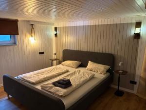 a bed in a bedroom with a blanket on it at Ferienwohnung Korbach in Korbach