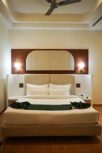 Giường trong phòng chung tại Hotel Pacific Primee