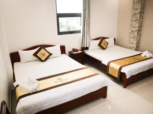 Postel nebo postele na pokoji v ubytování MK Two Hotel + 65 fotografií