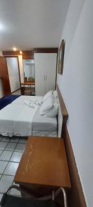 Giường trong phòng chung tại Pasargada flat