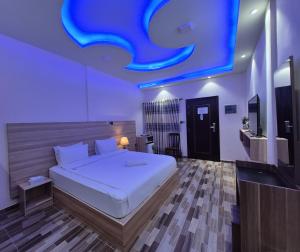 Giường trong phòng chung tại Aasna Inn