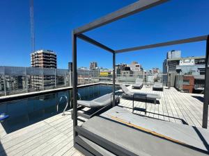 a balcony with a swimming pool on top of a building at Apartamento para 2 personas in Buenos Aires