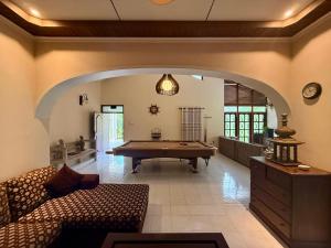 a living room with a pool table in it at Dark Green Resort - Airport Transit Villa in Negombo +20 photos