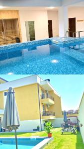 a large swimming pool with an umbrella next to a building at Самуил къща за гости in Ognyanovo