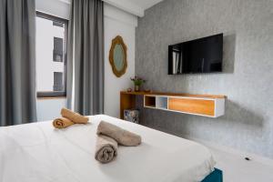 Ένα ή περισσότερα κρεβάτια σε δωμάτιο στο Golden Apartament Saranda