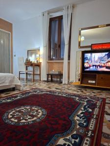 TV a/nebo společenská místnost v ubytování B&B La casa di Dorothy