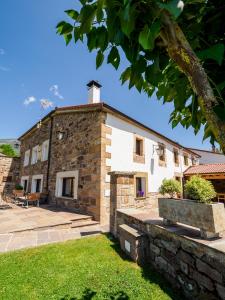 an exterior view of a stone building at La Casa De Los Pedros in Villar