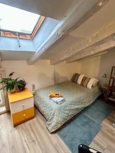 a bedroom with a bed in a attic at Buhardilla en Chueca, a pasos de Gran Vía in Madrid