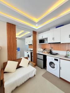 a kitchen with a bed and a sink in a room at saekyung marigondon 1 in Lapu Lapu City
