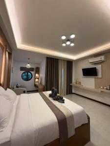 Ένα ή περισσότερα κρεβάτια σε δωμάτιο στο The Cushty Days Lanta