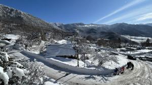 a group of people standing on a snow covered mountain at グランベルミヤツ in Yamanouchi