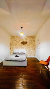 Кровать или кровати в номере Maison partagée 5 chambres Emmanuel Rey Valenciennes