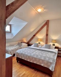 Postel nebo postele na pokoji v ubytování Apartmány Bašta & Wellness