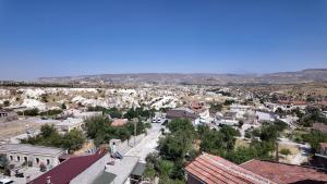 an aerial view of a small town with buildings at Gumus Hotel in Ortahisar
