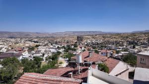 a view of a city from the roof of a building at Gumus Hotel in Ortahisar