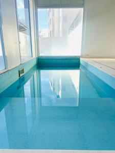 an empty swimming pool in a building at Carpe Diem Monte Hermoso in Monte Hermoso