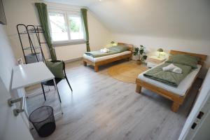 Postel nebo postele na pokoji v ubytování Sonnenhöhe Apartment + 26 fotografií