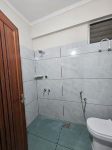 Ένα μπάνιο στο Capital Plaza Residency and conventional center