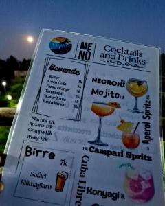 un menú para un restaurante con cócteles y bebidas en GHhome Zanzibar, en Pingwe 30 fotos más