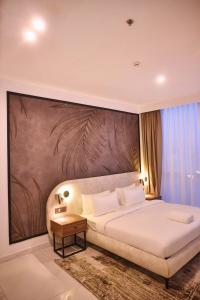 Giường trong phòng chung tại Azusa Hotel and Apartments