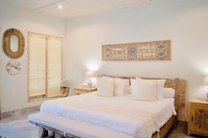 Ένα ή περισσότερα κρεβάτια σε δωμάτιο στο Dhauteya Villa +38 φωτογραφίες