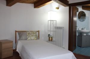 Ένα ή περισσότερα κρεβάτια σε δωμάτιο στο Lumira Vista - Borgo