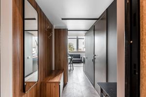 a hallway of a house with a mirror at Modern Urban loft in Vilnius +7 photos