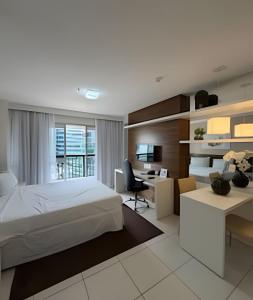 a bedroom with a bed and a desk at Hotel VISION in Brasilia +163 photos