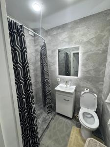 Koupelna v ubytování Apartament ultra-central