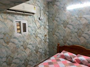 Postel nebo postele na pokoji v ubytování Arulravi illam