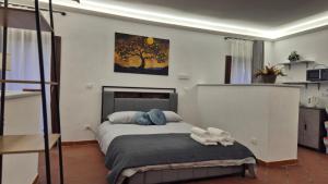 a bedroom with a bed with two stuffed animals on it at Antiche Mura in Celano
