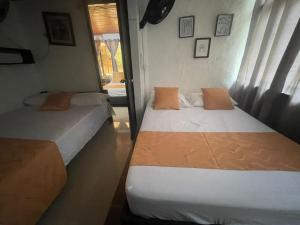 Postel nebo postele na pokoji v ubytování Cabaña San Nicolás