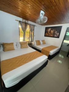 Postel nebo postele na pokoji v ubytování Cabaña San Nicolás