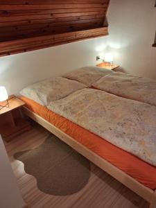 En eller flere senge i et værelse på Chata Anna Tatranská Štrba