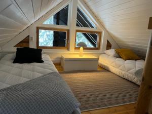 En eller flere senge i et værelse på Järvenrantamökki Nurmijärvellä