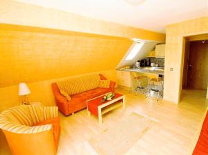 a living room with a couch and a table at Ferienwohnung Edelbrenner in Rimbach