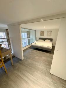 En eller flere senge i et værelse på Le Cosy de Croix-rousse