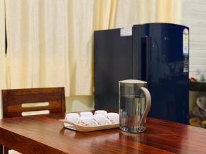 a blender sitting on top of a wooden table at Sadanand Villa in Jāmb