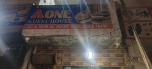 a sign for a guest house in a store at A One Guest House in Jalandhar