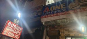 a building with signs on the side of it at A One Guest House in Jalandhar