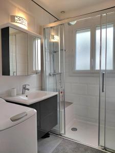 a bathroom with a shower and a sink at Maison Dizavel in Le Croisic +14 photos