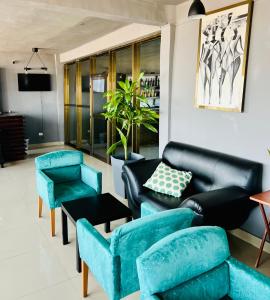 Χώρος καθιστικού στο Tris Estates Hotel & Suites