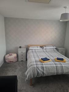 En eller flere senge i et værelse på SPEEDWELLCOMe