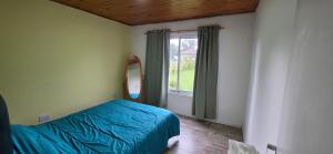 Ένα ή περισσότερα κρεβάτια σε δωμάτιο στο Chapadmalal