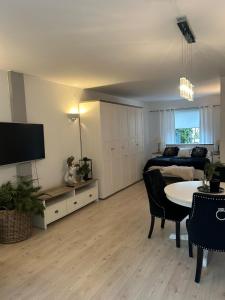 Μια τηλεόραση ή/και κέντρο ψυχαγωγίας στο Lux apartament Chodzież, ul Zwycięstwa 13
