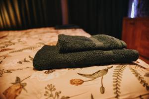 a group of towels sitting on top of a bed at Apartament Hallera in Chełmno +26 photos